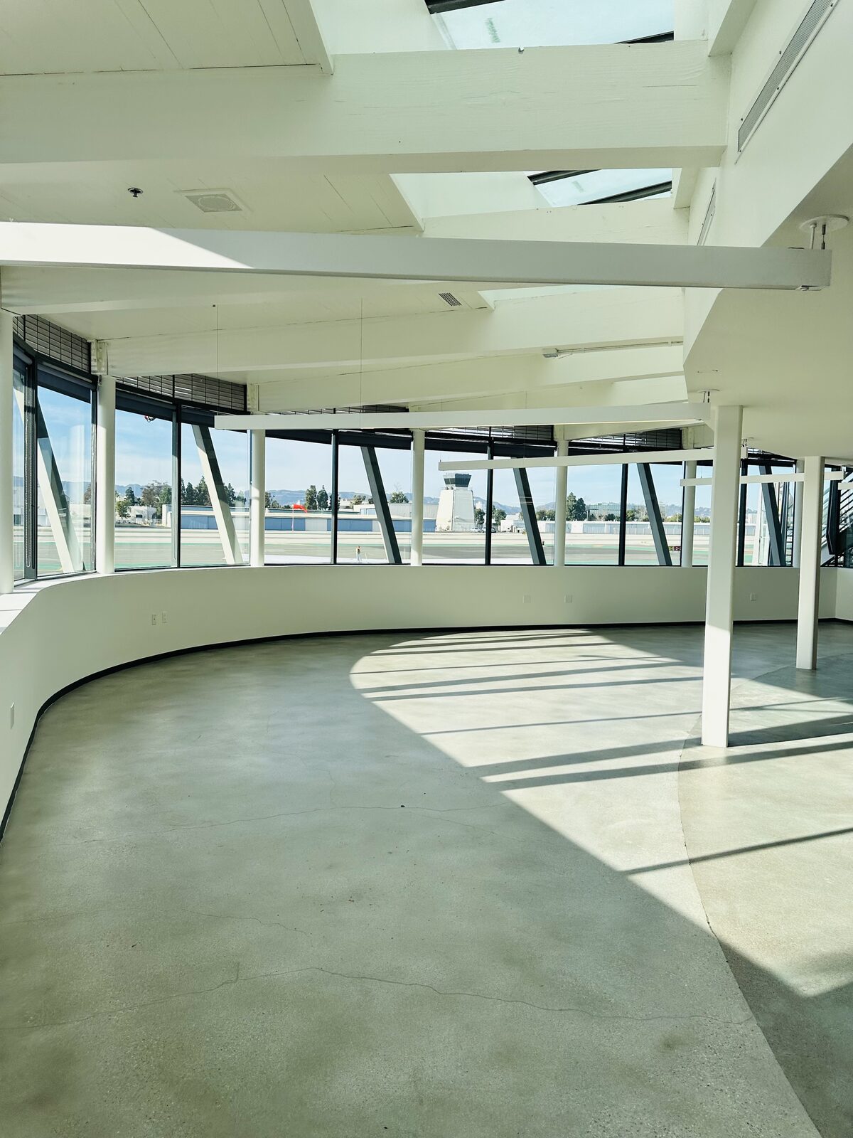 Interior space at Santa Monica Airport with control tower visible